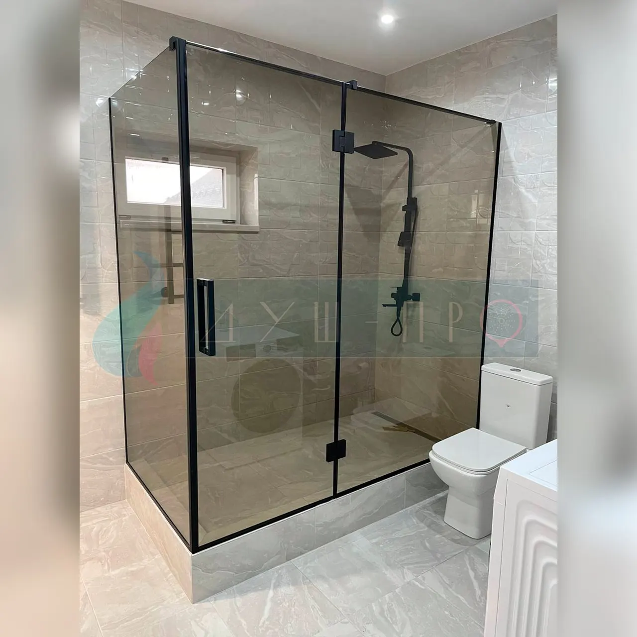 Glass corner shower enclosure in a modern bathroom